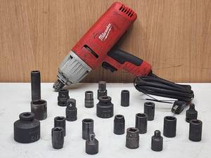 Milwaukee Electric Impact Wrench with Assorted Sockets