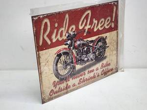 This Ride Free Garage Tin Sign