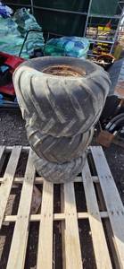 Three Carlisle Tractor Tires on Rusted Rims