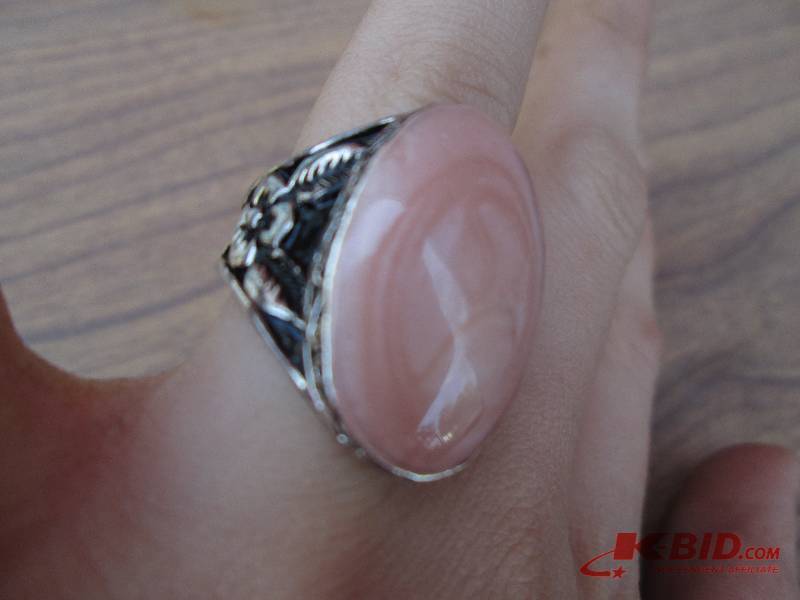 small peach colored ring...