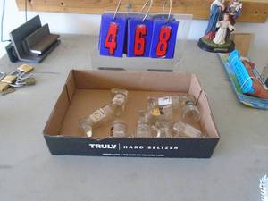 Flat with liquor shot glass boots. As shown. CASH ON SITE ONLY. PICKUP IS TUESDAY MAY 19TH FROM 11 AM TO 4 PM. REGARDLESS WHAT THE SCHEDULE STATES.