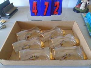 Flat with liquor shot glass boots. As shown. CASH ON SITE ONLY. PICKUP IS TUESDAY MAY 19TH FROM 11 AM TO 4 PM. REGARDLESS WHAT THE SCHEDULE STATES.