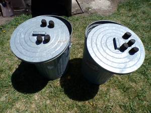 Two 18 Round x 24 Tall Metal Trash Cans with Lump Charcoal Bricks
