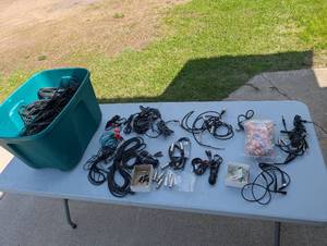 Assortment of xlr, 3.5, 14 audio cables and adapters.