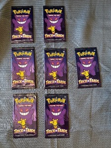 7 sealed packs of Pokemon trick or trade cards