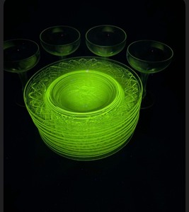 Lot of plates and glass that GLOW green