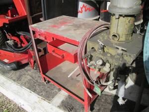 Graco paint sprayer mounted to a wo...