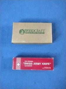 Woodcraft folding pocket knife featuring a wooden handle with the brand logo.