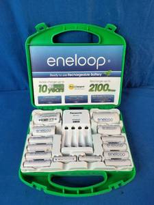Panasonic Eneloop Power Pack Kit featuring rechargeable batteries, a charger, and plastic storage case.