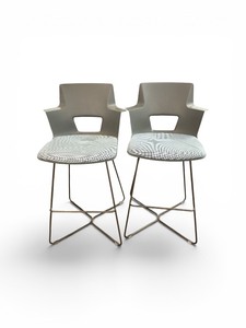 Steelcase Shortcut X Base Stool featuring a molded plastic shell and an X-shaped metal frame
