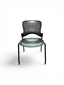 Herman Miller Caper stacking chair featuring a contoured, perforated backrest and a black steel frame