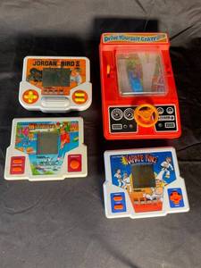Tiger Electronics Handheld Game Lot of 4 Jordan Vs Bird, Miniature Golf, Karate King & Drive Yourself Crazy