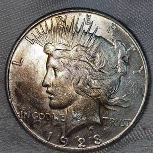 1923s Peace Dollar $1 XF, Gold Toning