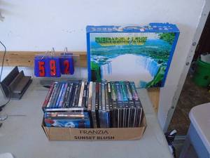 Flat of dvds & electronic picture display. As shown. CASH ON SITE ONLY. PICKUP IS TUESDAY MAY 19TH FROM 11 AM TO 4 PM. REGARDLESS WHAT THE SCHEDULE STATES.