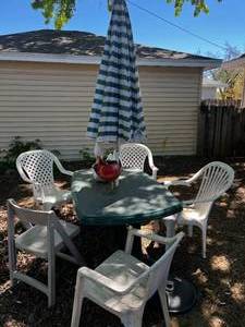 Outdoor Patio Table, 4 Plastic Unmatched Chairs, Umbrella, Base & Planters
