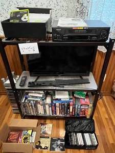 Entertainment Cabinet w Sharp VC-A593 VCR, Onn 24 TV & VHSDVD Media Lot