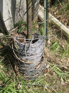 Spool of fence wire and 4ft sign po...