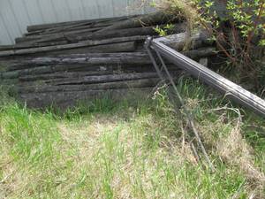 Large pile of weathered wood planks...