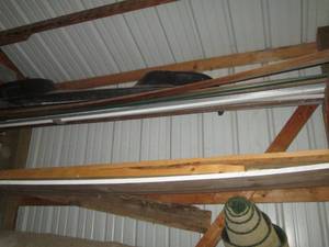 Bundles of assorted wood planks and...