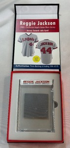 Reggie Jackson 1980s Game Jersey Swatch from sportscards.com