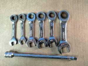 Snap On 38 Extension and Huskey SAE chrome-plated stubby ratcheting combination wrenches, often used for working in tight spaces.