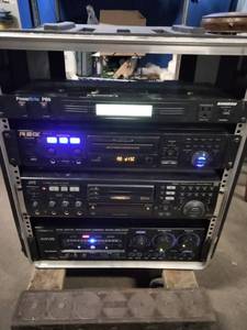 This is a professional karaoke equipment rack containing various audio components.