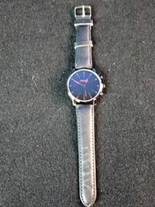 Brand New  Geneva brand minimalist quartz watch featuring a black dial with red hour markers.