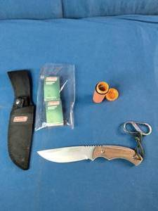 a Coleman 2000015157 fixed-blade knife with a stainless steel blade and wood handle