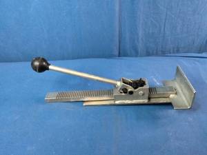 This is a Powernail PowerJack Model 100 flooring jack used to position and straighten hardwood floor boards.