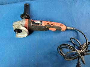 This is a Black & Decker angle grinder, likely a model in the 4-12 or 5-inch range