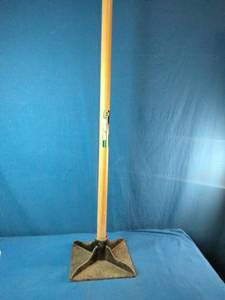 This is a True Temper 8 inch by 8 inch steel head tamper with wood handle