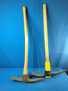 These are pick mattocks, commonly used for digging in hard soil or cutting through roots