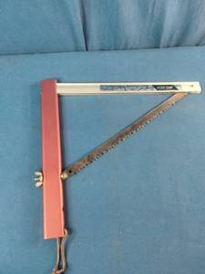 This is a Sven-Saw folding camping saw with a red aluminum handle.