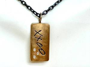 14K XXOO Pendant on 22in Sterling Silver Chain