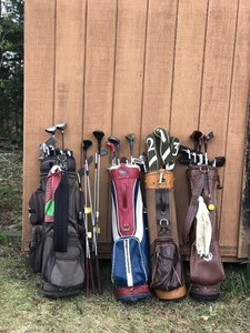 4 - Golf Bags with Club and all Kinds of Surprises in The Pockets