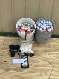 2 - 5 Gallon Pails of Golf Balls - Pair of Golf Gloves - 2 Pair of Sunglasses - Pat Golfer Wrist Counter, Range Finder and bag of whiffle balls