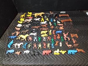 box of toy Indians, cowboys, horses, fence and animals