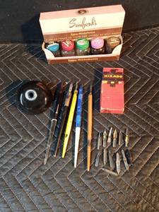 Vintage inkwell with extra pens and tips