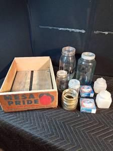Mesa Pride wooden box with assorted glass and 2 boxes of canning jars and jar rubber gaskets