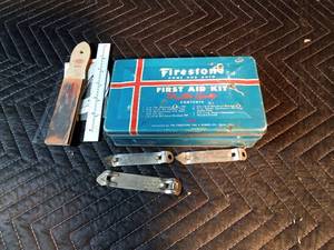 Vintage firestone Home and Auto first aid kit filled with misc. Hamms, Schmidt, Grainbelt bottle openers and more