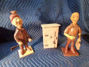 Wooden man. outhouse, and lady