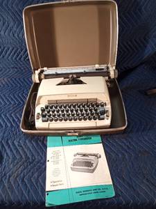 Vintage Sears electric typewriter in case with manual - works