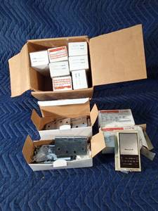 2 New Honeywell thermostats and 9 boxes of new rectangular butt hinges