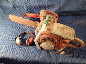 2 Homelite chainsaws and earmuffs