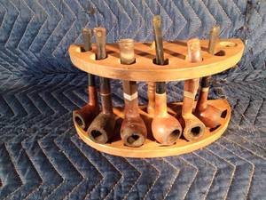 6 Tobacco pipes in a pipe holder
