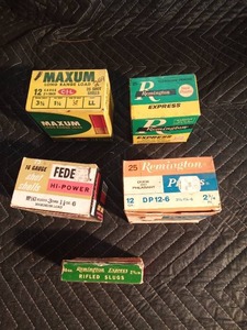 4 boxes of shotgun shells and 1 Remmington rifle slug in vintage boxes