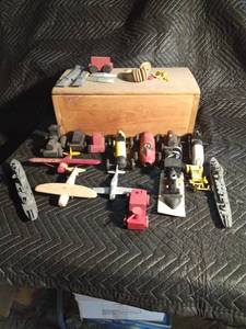 Wooden box of wooden vehicles airplanes, trains, race cars and more
