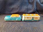 1950’s Wolverine tin litho toy set featuring a 4 door Sedan and a house trailer with wooden wheels