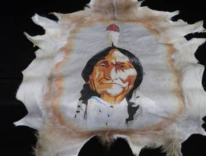 HAND-PAINTED ART ON ANIMAL HIDE