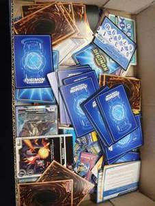 MIXED LOT YU GI OH AND DIGIMON CARDS